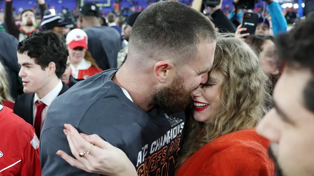 Travis Kelce celebrates with Taylor Swift on the field after the AFC Championship. (Patrick Smith)